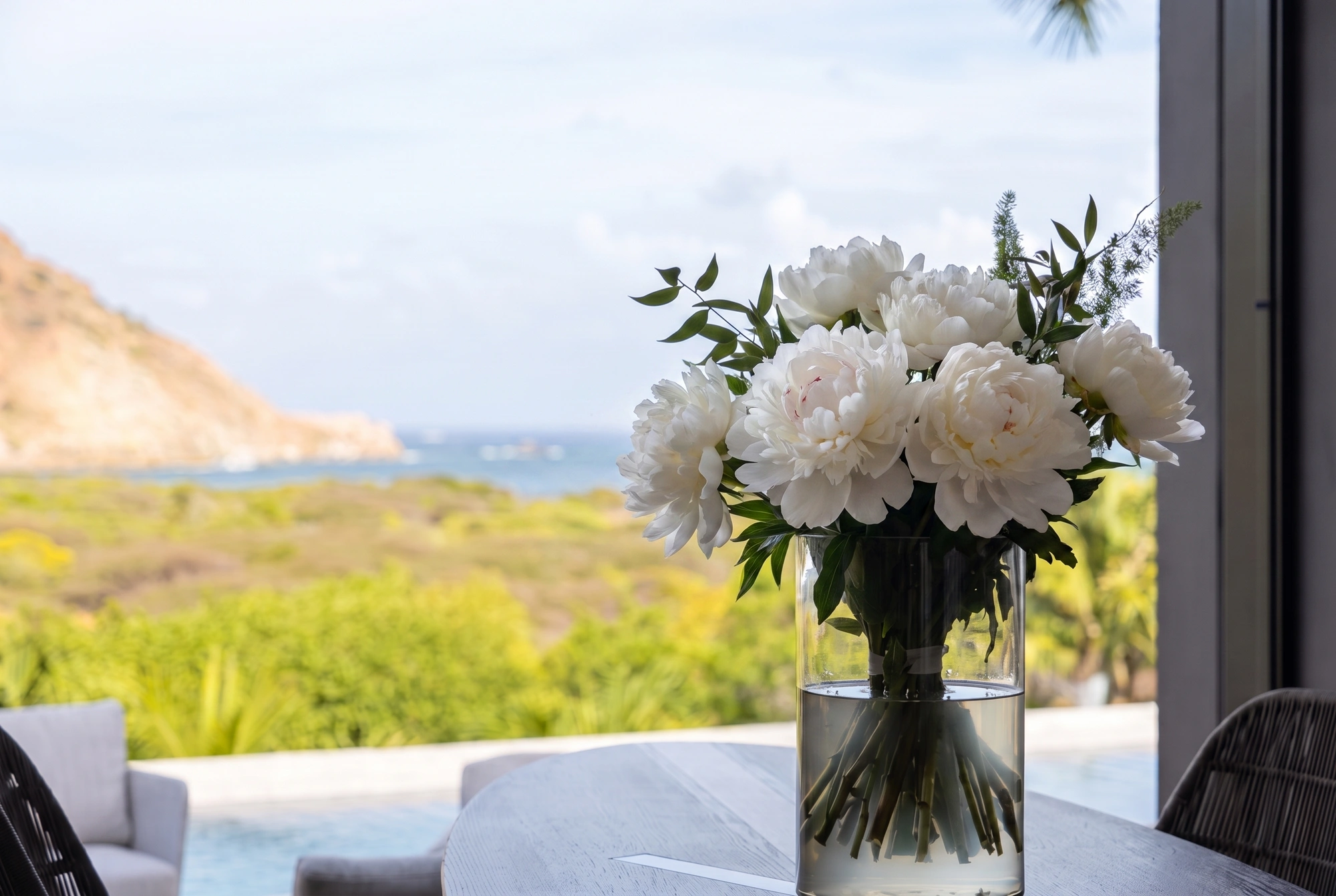 The hillside and the water beyond the terrace
